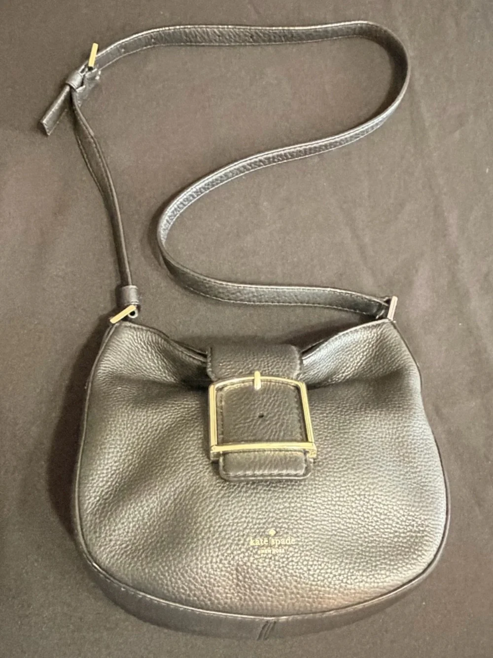 Kate Spade Black Saddle Bag Like New Condition. Very stylish and comfortable.